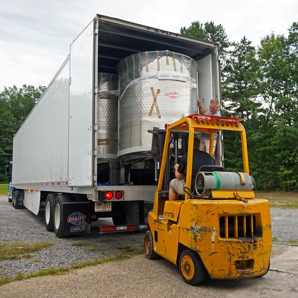 Removing new tanks from the truck